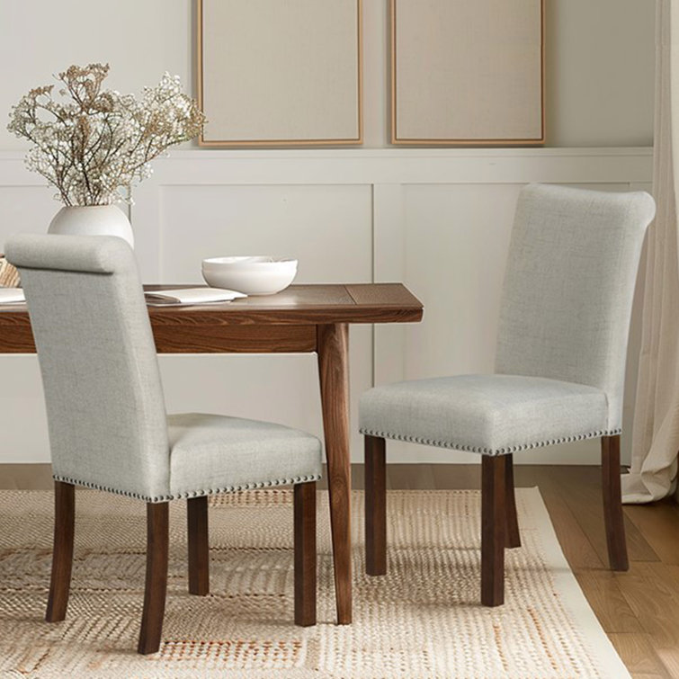Natural Upholstered Side Chair with Wood Legs and Nailhead Trim