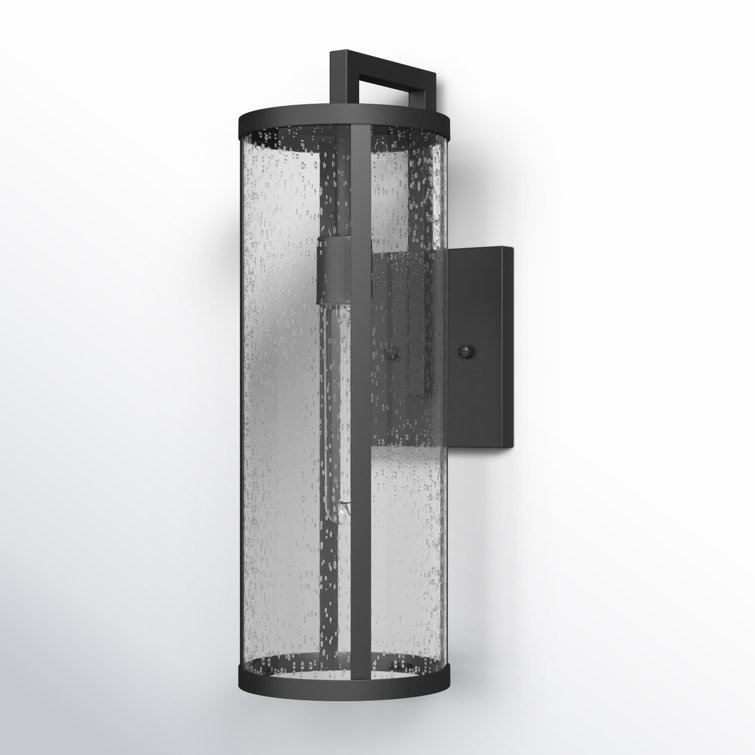Medium Black Aluminum Cylinder Outdoor Wall Light with Seeded Glass