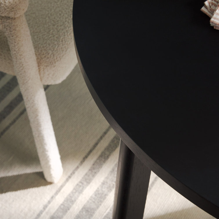 Black Solid Wood Round Dining Table with Geometric Legs