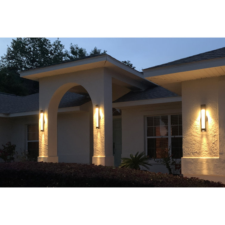 Sleek Satin Black Outdoor Wall Sconce with Seedy Glass
