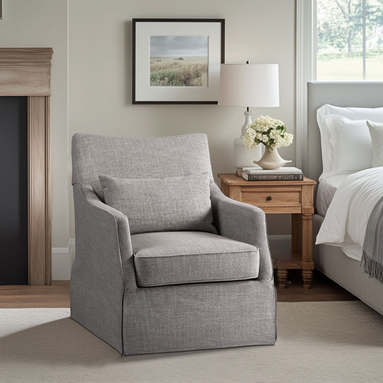 Gray Skirted Swivel Armchair with Lumbar Pillow