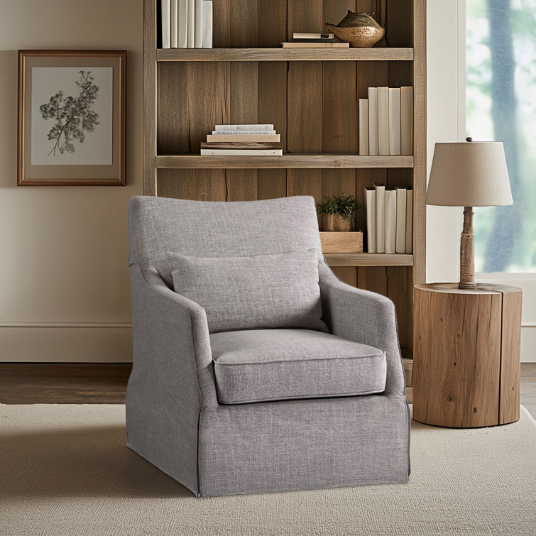 Gray Skirted Swivel Armchair with Lumbar Pillow