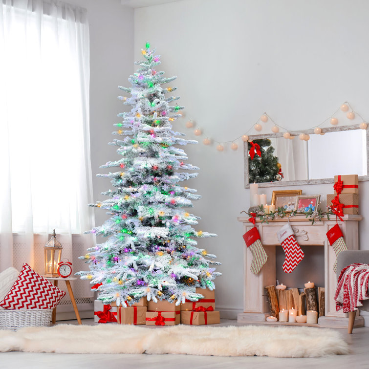 9-Foot Flocked Pine Christmas Tree with Multicolor LED Lights