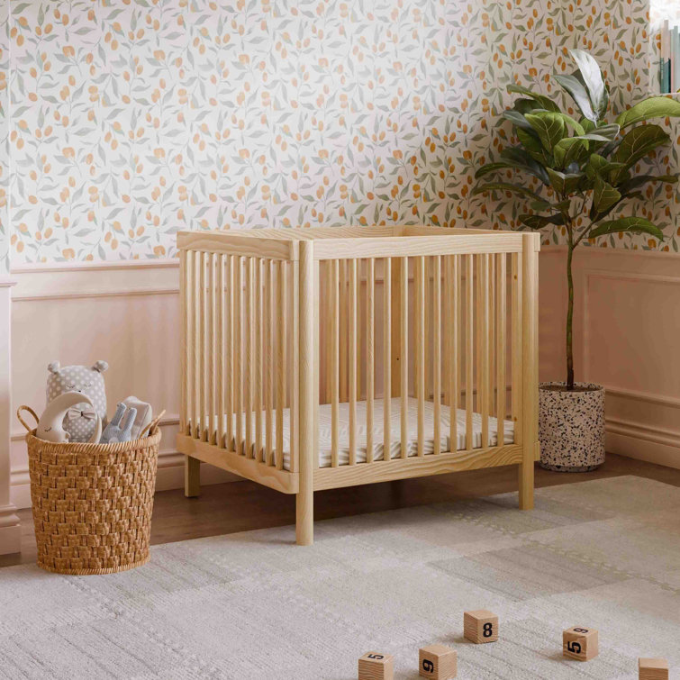Blonde Pine Wood Convertible Crib with Rounded Spindles