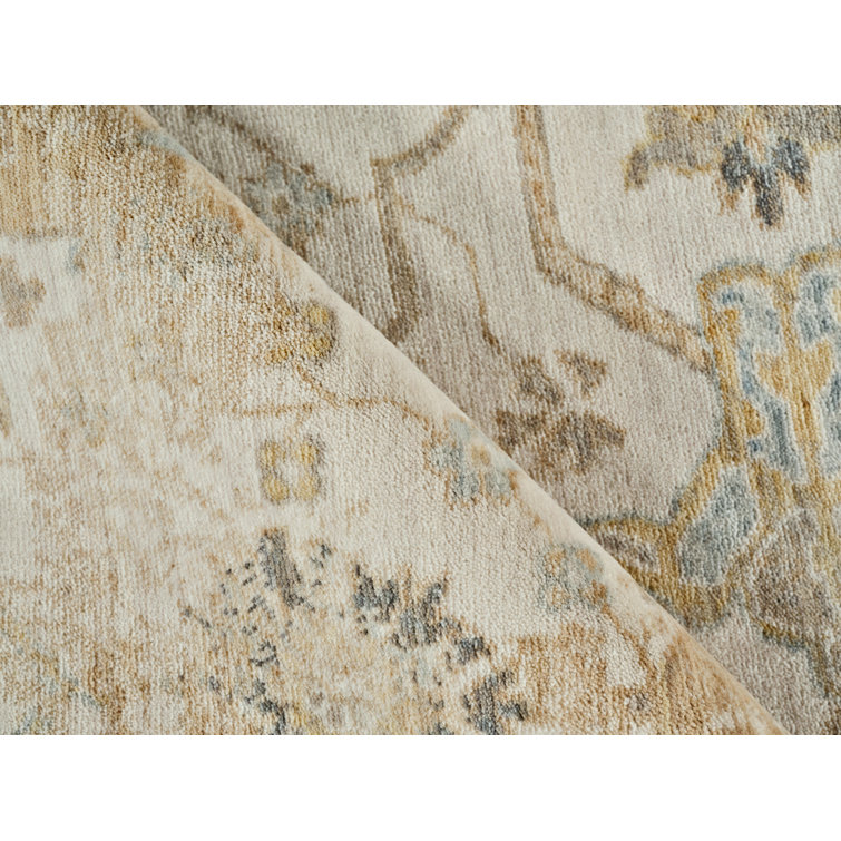 Handmade Ivory Wool and Synthetic Floral Motif Area Rug, 6' x 9'