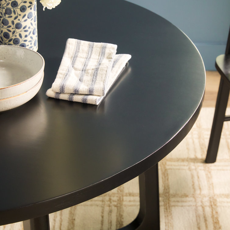 Black Solid Wood Round Dining Table with Geometric Legs