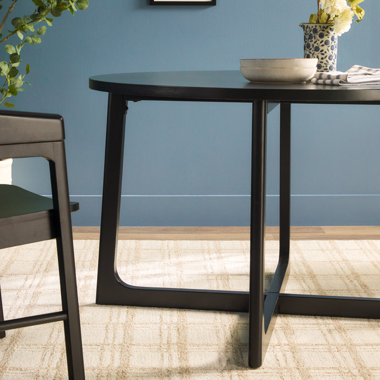 Black Solid Wood Round Dining Table with Geometric Legs