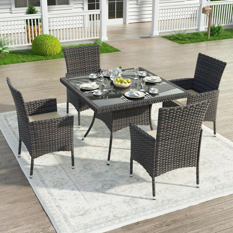 5-Piece Dark Brown Rattan Outdoor Dining Set with Sand Cushions and Glass Tabletop