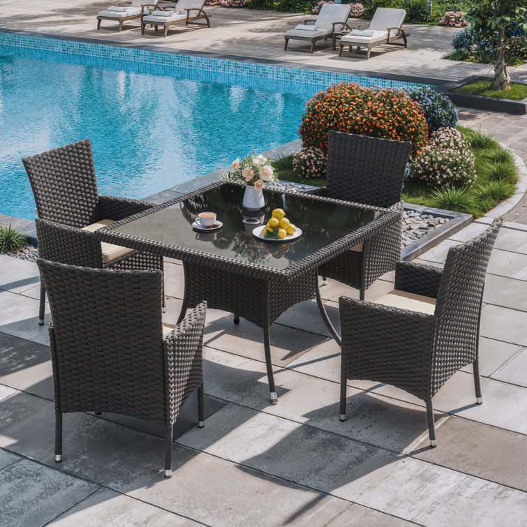 5-Piece Dark Brown Rattan Outdoor Dining Set with Sand Cushions and Glass Tabletop