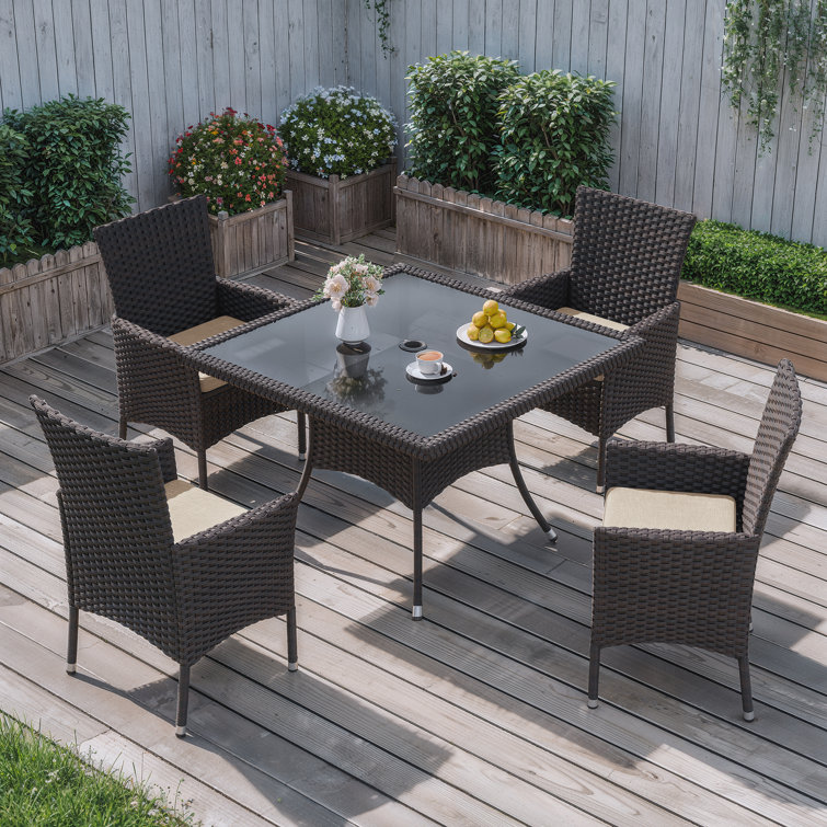 5-Piece Dark Brown Rattan Outdoor Dining Set with Sand Cushions and Glass Tabletop