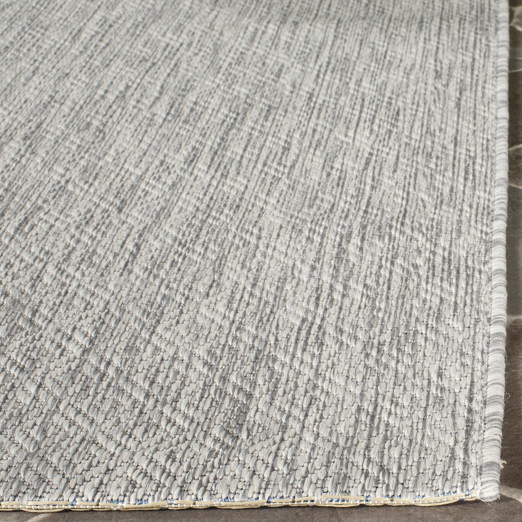 Delano Monochrome Gray Synthetic 6'7" x 9'6" Indoor/Outdoor Rug