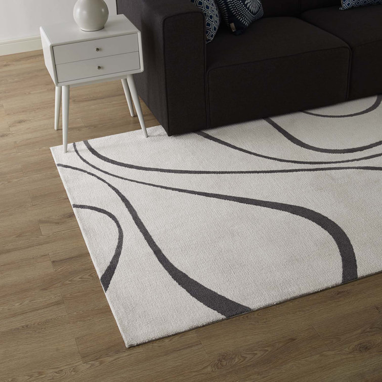Ivory and Charcoal Abstract Swirl 5' x 8' Synthetic Area Rug
