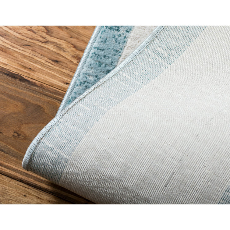 Turquoise and Ivory Rectangular Synthetic Area Rug