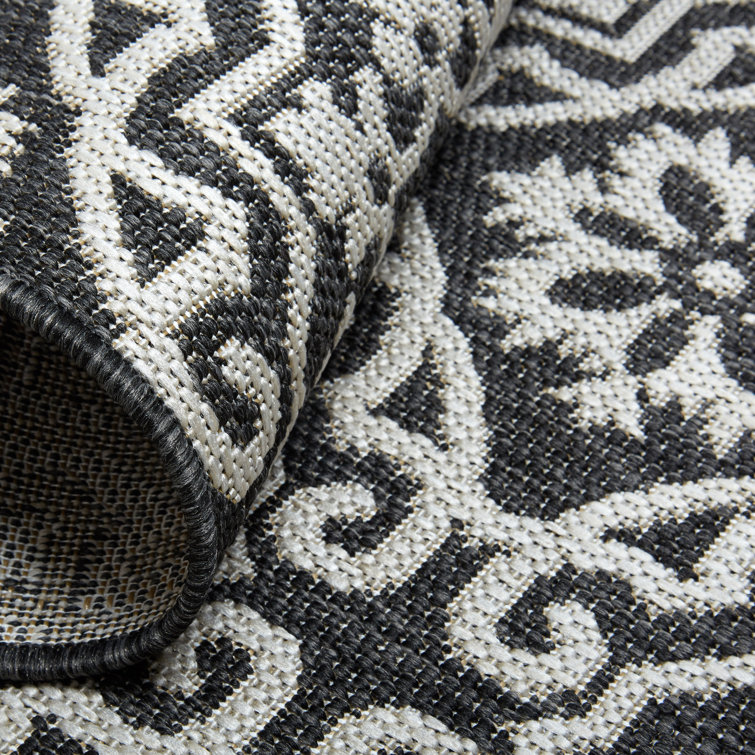 Danica 5'2" x 7'2" Black/Gray Synthetic Medallion Area Rug
