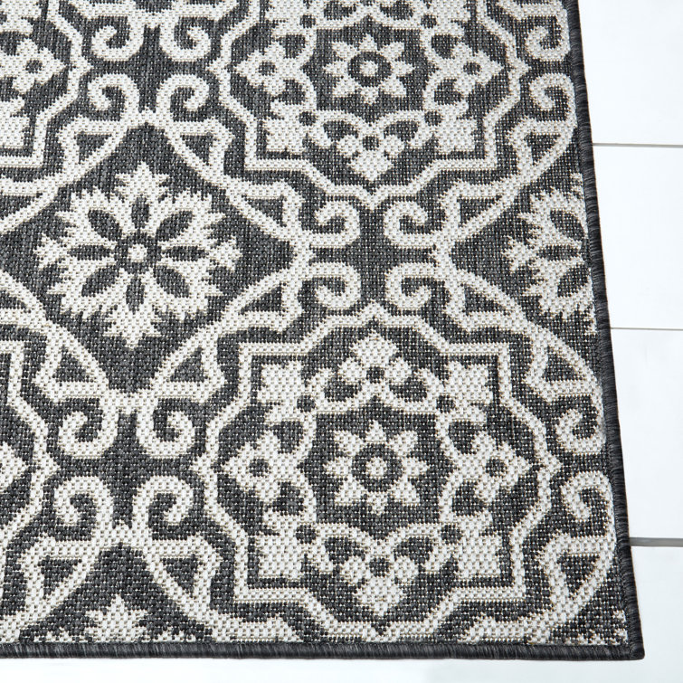 Danica 5'2" x 7'2" Black/Gray Synthetic Medallion Area Rug