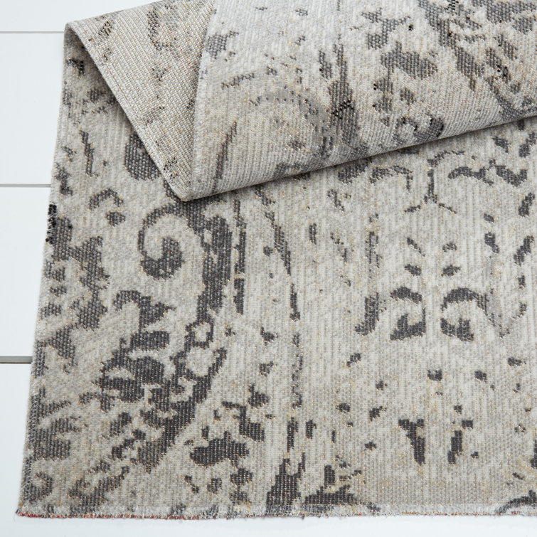 Ivory and Grey Round Synthetic Paisley Area Rug