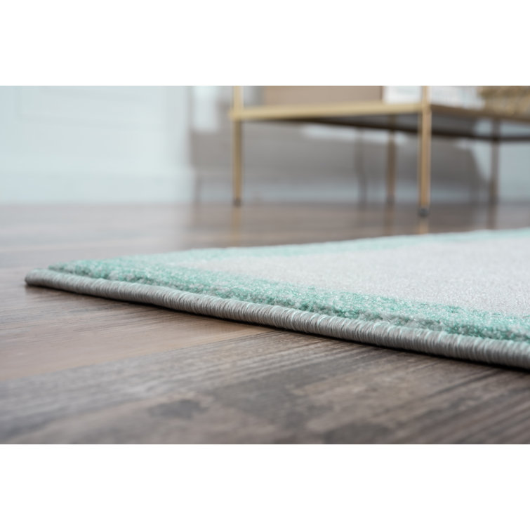 Turquoise and Ivory Rectangular Synthetic Area Rug
