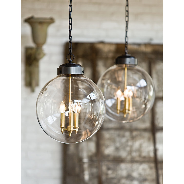 Clear Glass Globe Pendant with Oil Rubbed Bronze and Brass Finish