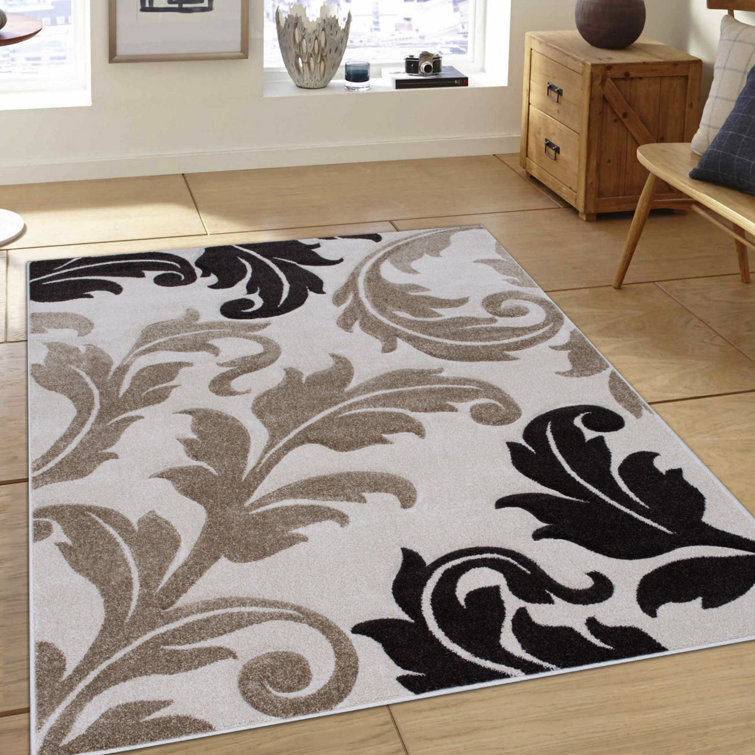 Ivory and Black Floral Synthetic 5' x 7' Area Rug