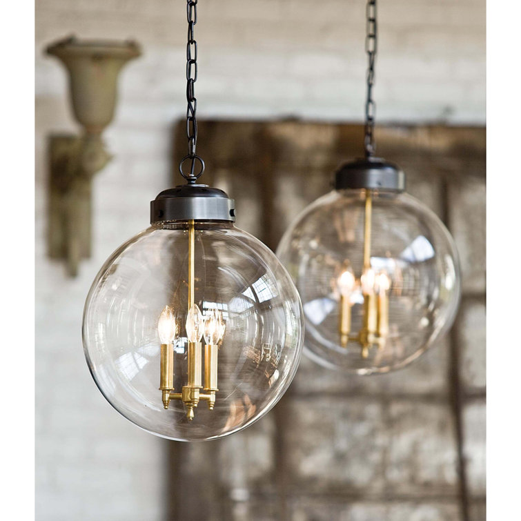 Clear Glass Globe Pendant with Oil Rubbed Bronze and Brass Finish