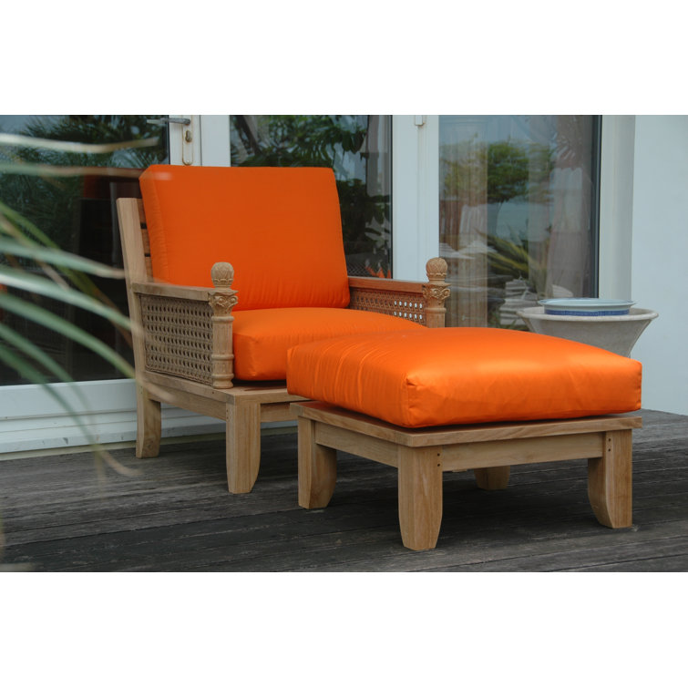 Teak Lounge Chair with Orange Cushions and Wicker Sides