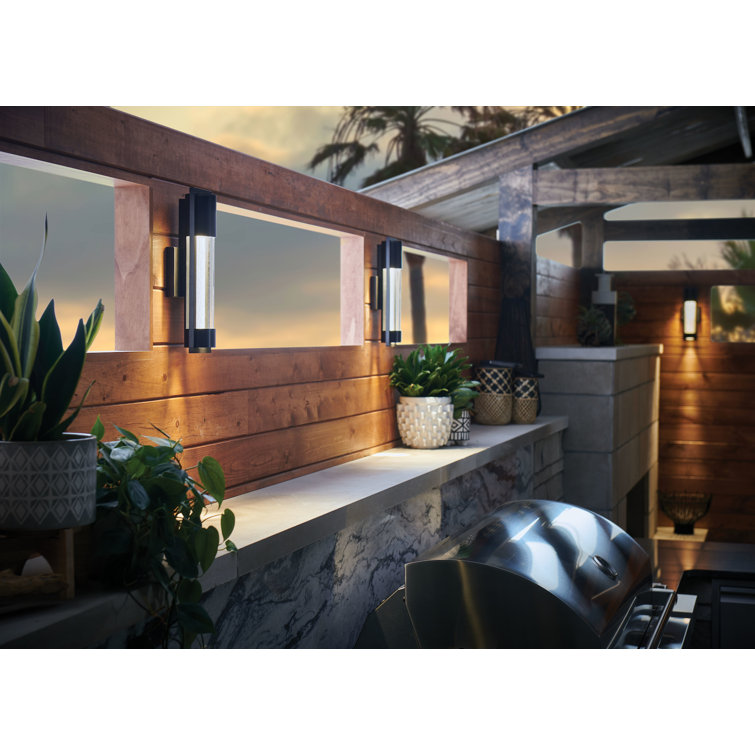 Sleek Satin Black Outdoor Wall Sconce with Seedy Glass