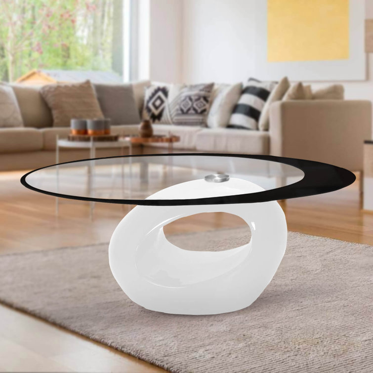 White Oval Glass Top Coffee Table with Abstract Base