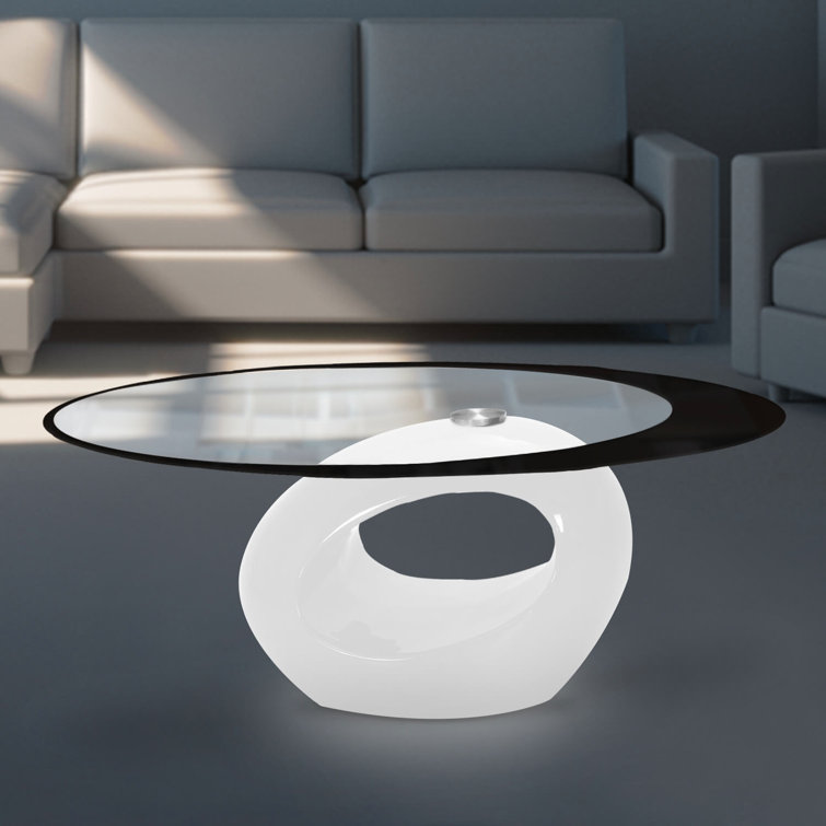 White Oval Glass Top Coffee Table with Abstract Base