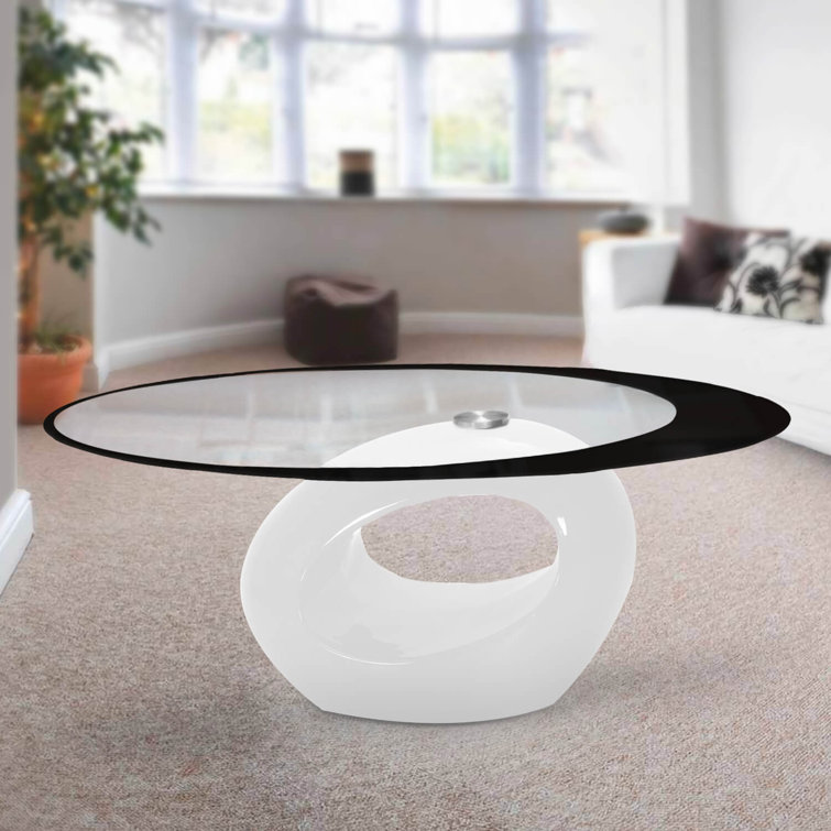 White Oval Glass Top Coffee Table with Abstract Base
