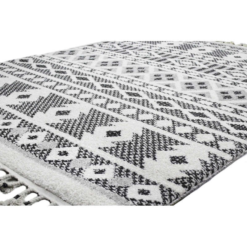 Handmade Geometric Black Synthetic 8' x 10' Stain-Resistant Rug