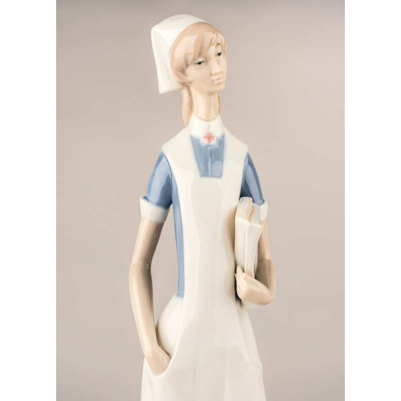 Matte White Porcelain Nurse Figurine with Delicate Petal Details