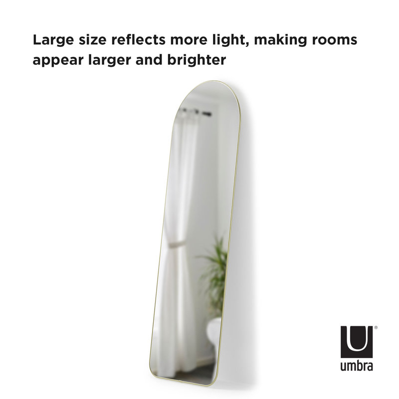 Elegant Arch Brass Leaning Floor Mirror with Sleek Metallic Rim