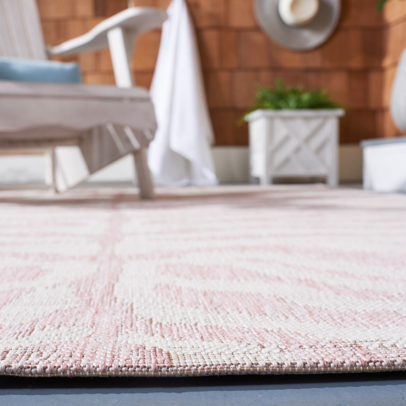 Ivory and Pink Round Animal Print Synthetic Rug