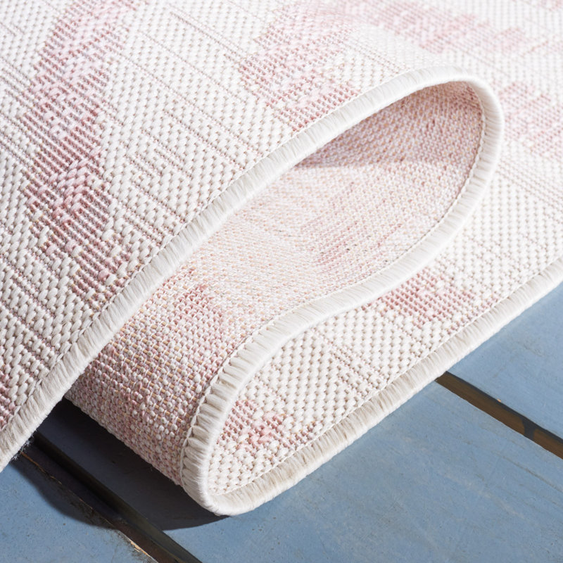 Ivory and Pink Round Animal Print Synthetic Rug