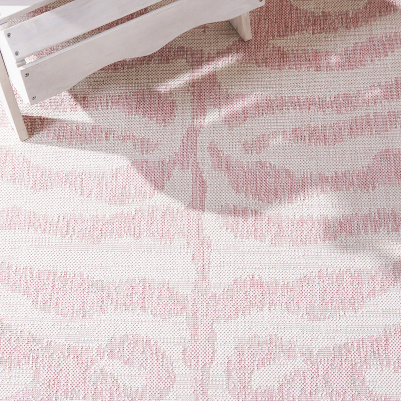 Ivory and Pink Round Animal Print Synthetic Rug