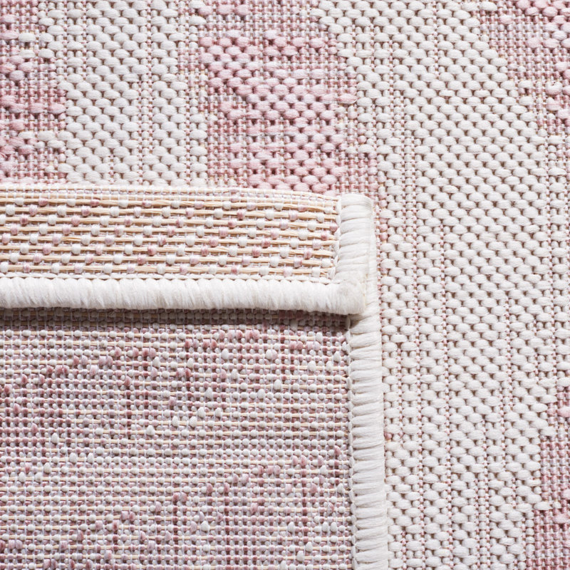 Ivory and Pink Round Animal Print Synthetic Rug