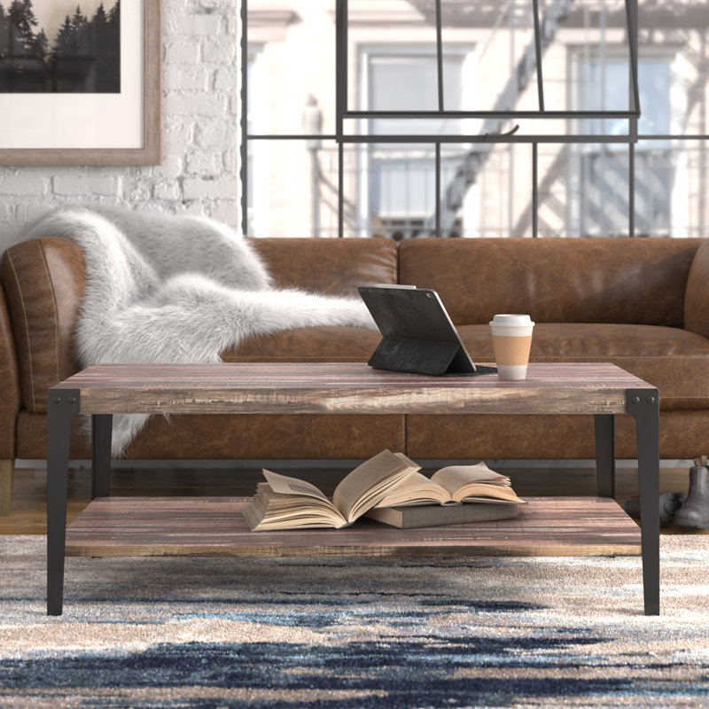 Elegantly Rustic Industrial Coffee Table with Metal Legs and Distressed Wood