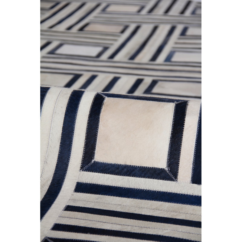 Handmade Ivory and Blue Geometric Cowhide Area Rug