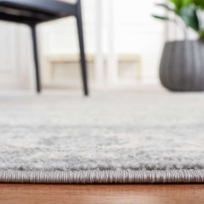 Heirloom Gray 9' x 12' Synthetic Hand-Knotted Area Rug