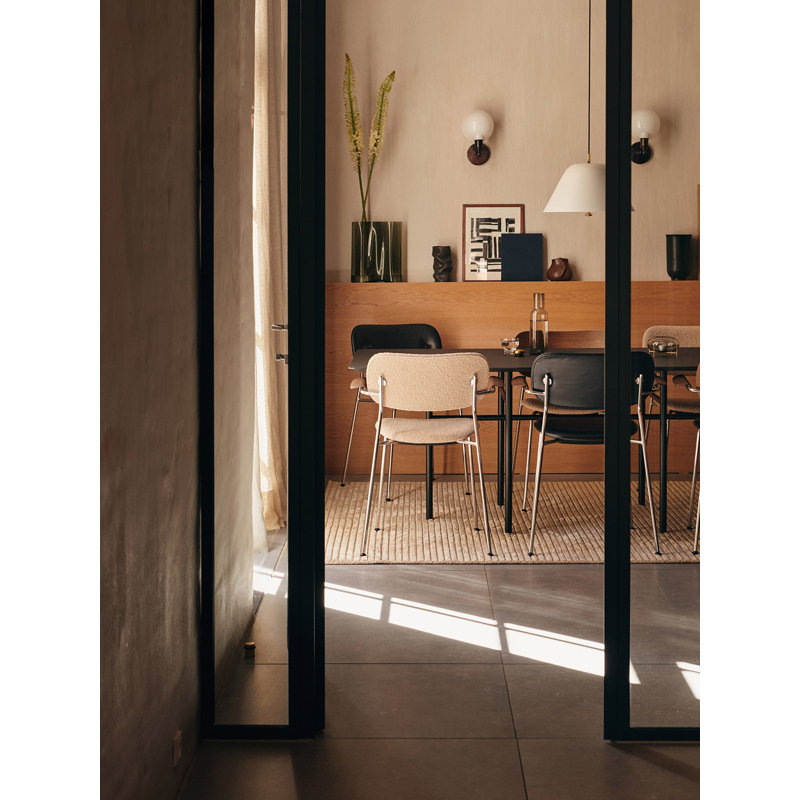 Cozy Minimalist Black Leather and Chrome Dining Chair with Armrests
