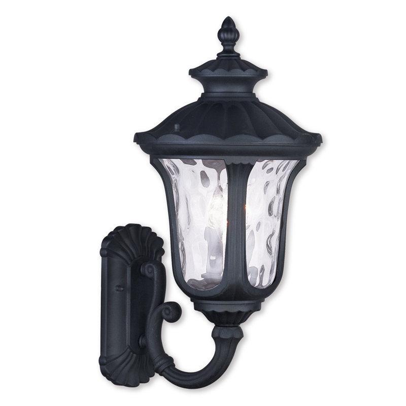 Artisanal Textured Black 3-Light Outdoor Lantern Sconce with Clear Water Glass