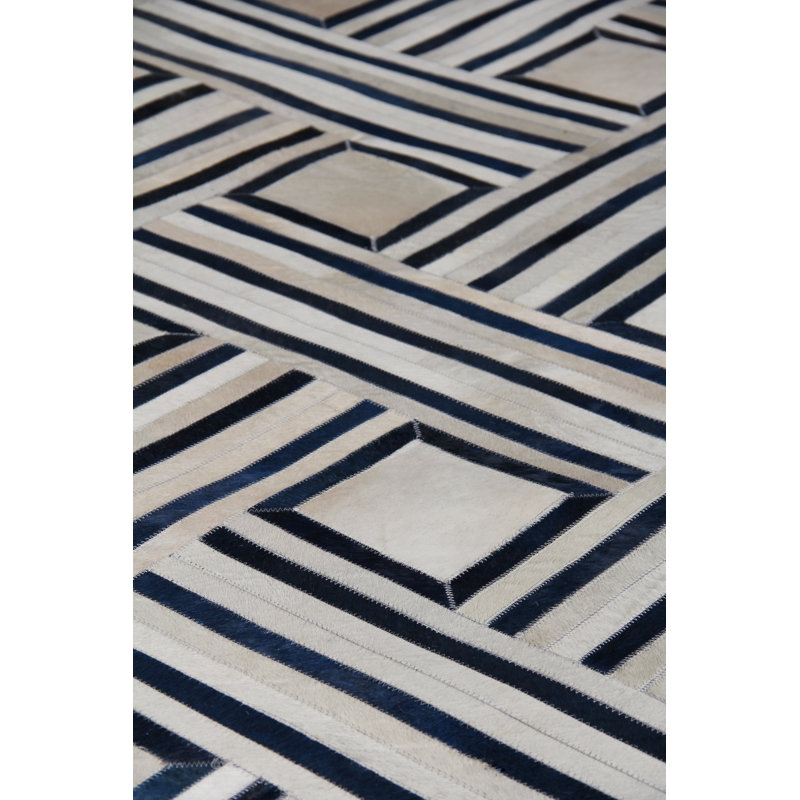 Handmade Ivory and Blue Geometric Cowhide Area Rug