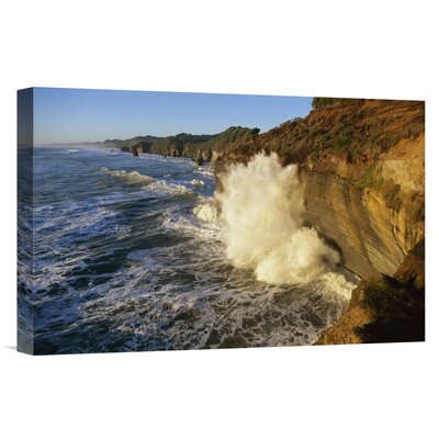 New Zealand Tongaporutu 'Swells at High Tide Against Sandstone Cliffs' - Photograph Print on Canvas -  East Urban Home, NNAI6443 39917297