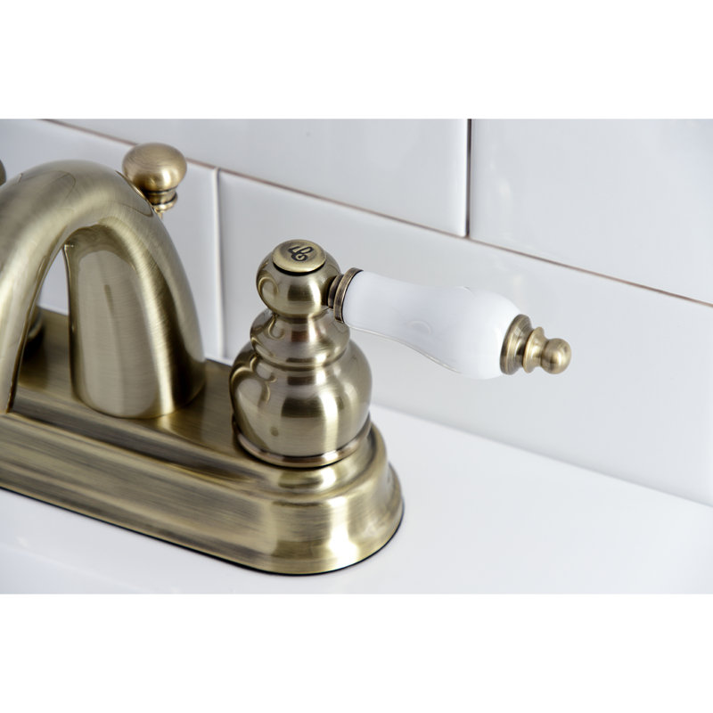 Kingston Brass Restoration Two-Handle 3-Hole Deck Mount 4" Centerset Bathroom Faucet, Vintage Brass