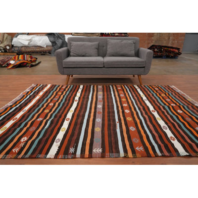Tapis tons chauds terreux dans un kilim rayé rustique 6 x 8