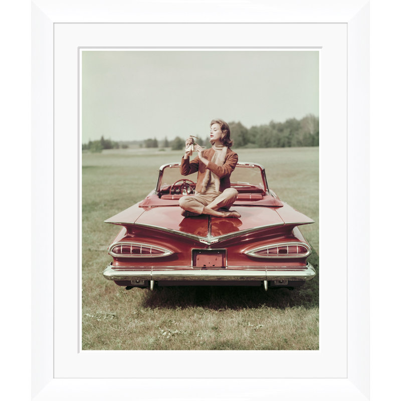 Vogue Magazine, "Sitting On A Chevrolet Convertible," John Rawlings, November 1, 1958 Print by John Rawlings, 35.5" H x 30" W