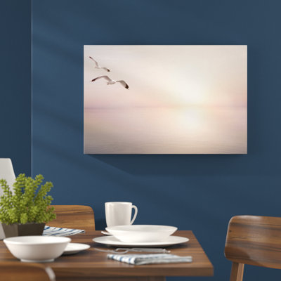 Leinwandbild Möwen am Meer bei Sonnenaufgang