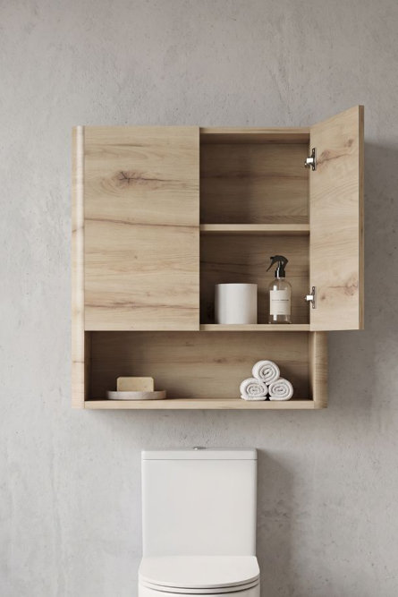 Wall-mounted light wood bathroom cabinet with open shelves and a cabinet door featuring storage for toiletries and towels above a toilet.