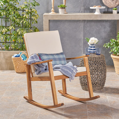 Arend Coastal Acacia Wood Outdoor Rocking Chair with Cushions and Cross-Back Detailing by Gracie Oaks