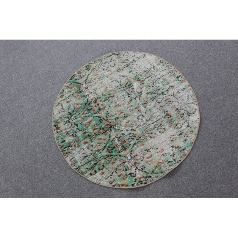 Tapis rond rond d'inspiration turque vert parfait pour une petite entrée ou un vestibule